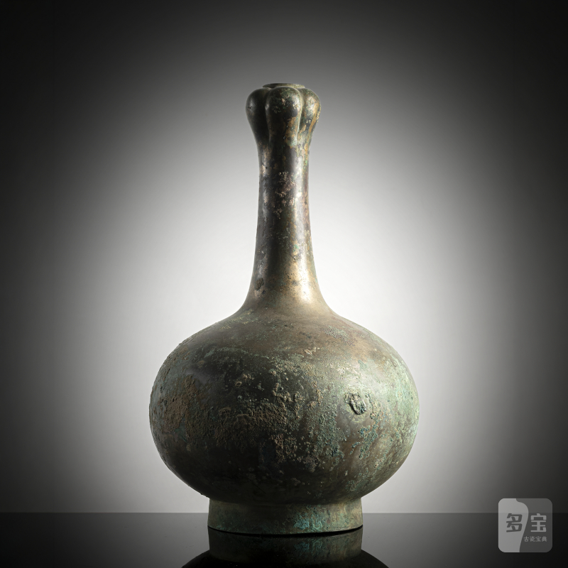 A bronze "garlic head" bottle vase